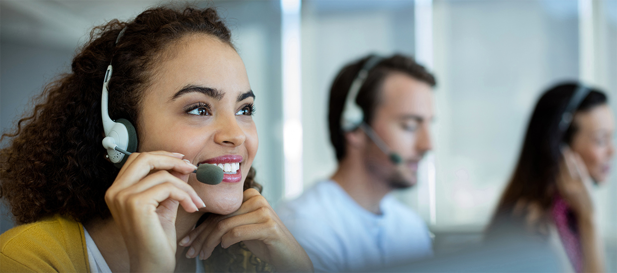 Image of woman answering the telephone in a call center